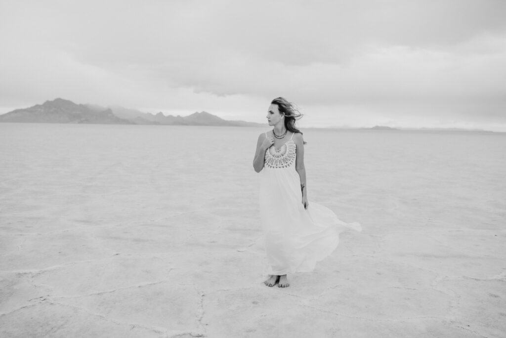 A bride poses on the Bonneville Salt Flats during a Utah elopement