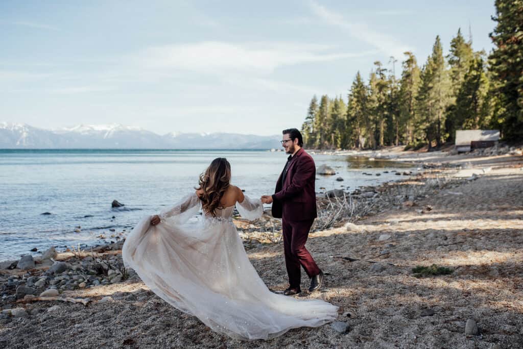 elopement couple dancing on the beach of Lake Tahoe